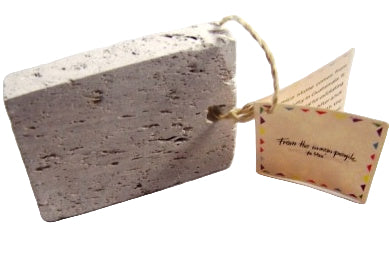 Rectangular stone block with a tag on a white background