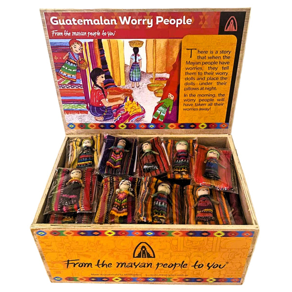Box of Guatemalan worry people dolls with colorful packaging.