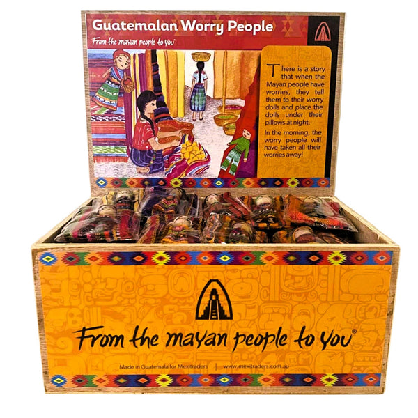 Box of Guatemalan Worry People dolls with colorful packaging and text.